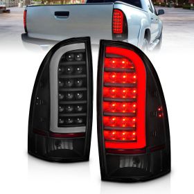 AmeriLite for 2005-2015 Toyota Tacoma Pickup C-Type LED Tube Smoke Black Tail Light Assembly Set - Driver and Passenger Side