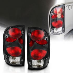 AmeriLite Black Replacement Tail Lights For 95-00 Toyota Tacoma Pickup Truck- Passenger and Driver Side. Bulb and Harness included