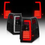 AmeriLite for 2007-2017 Ford Expedition [Full LED] C-Type Tube Smoke Black Replacement Tail Lights Set - Passenger and Driver Side